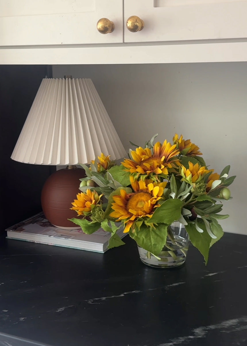 Faux Sunflower and Olive Leaf Arrangement in Glass Vase - 11"